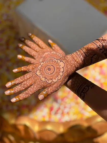 The sunlight catching the beautiful, deep orange stain of this floral mandala design. This is the kind of rich color you can expect from my natural henna.