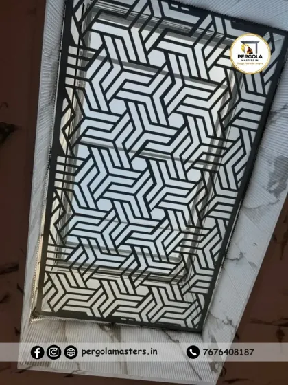 A close-up of a skylight with a complex, interlocking 3D cube pattern. This laser-cut design creates a visually deep and intricate effect, adding a sophisticated and modern touch to the ceiling.