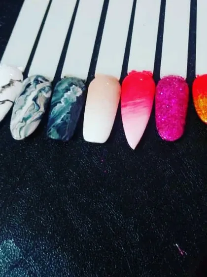 A few sample nail tips to spark your imagination. This shows different techniques like black and white marble, a pink ombre fade, and full-coverage glitter.