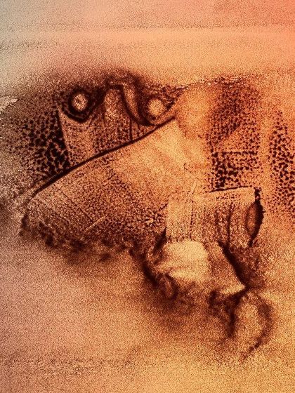 An untitled abstract sand painting with a mysterious, creature-like form. My experimental work often explores shapes that emerge organically from the sand.