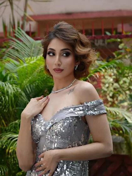A stunning shot from a BHI photoshoot, featuring a model in a silver sequin dress. This is the quality of work we help you create.