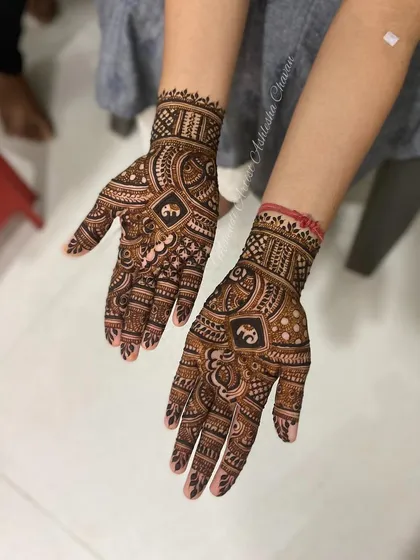 A cute baby elephant motif in a sider mehendi. It's a fun and playful element to add to any design.
