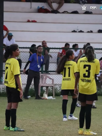 Locked in during a crucial tournament match in Goa. You can see the focus and communication between our players on the field, with spectators watching from the stands. This is what high-stakes football looks like.