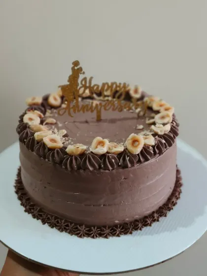 A delicious hazelnut anniversary cake, one of my popular flavor options for a nutty and rich celebration treat.