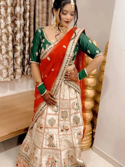 A beautiful traditional lehenga with peacock and tree motifs, perfect for a bride who loves classic designs.
