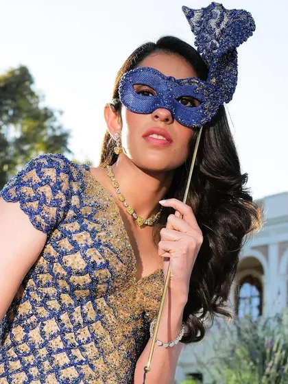 The complete masquerade look with the custom Versace gown and matching mask. It’s all about creating a fantasy.