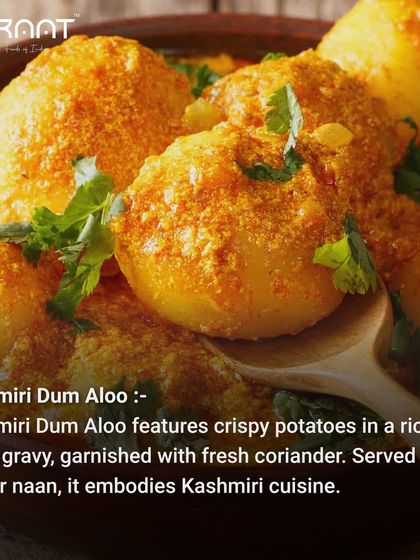 The final Kashmiri Dum Aloo, with crispy potatoes in a rich, spicy gravy, garnished with fresh coriander.