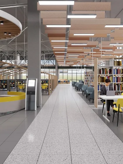 A long view of the Amity University library in Hyderabad. The design emphasizes scale and light, with rows of bookshelves flanked by various seating areas to support both individual and group study.