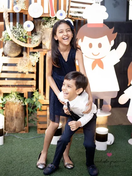 The pure, uninhibited joy of childhood. I love capturing siblings in their element, whether they are sharing a secret or bursting into laughter. These candid portraits are all about freezing the genuine energy and bond that they share.