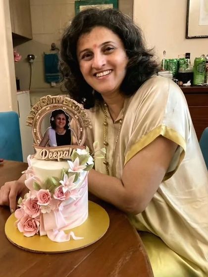 A heartfelt cake for my dear friend Deepali's 50th birthday. This elegant cake features an edible photo frame and delicate, handcrafted pink sugar roses.