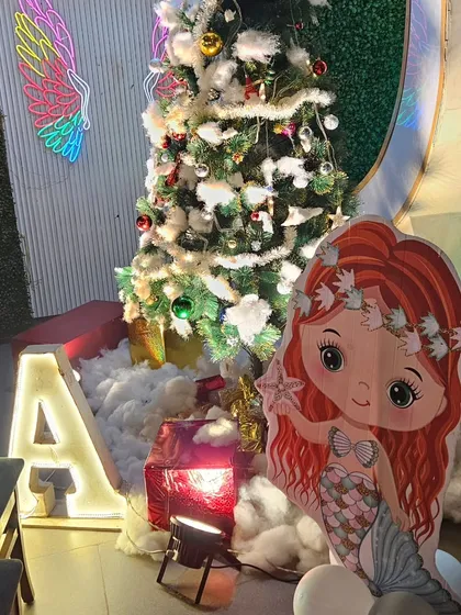 This mermaid party had a fun twist with a decorated Christmas tree and artificial snow. It shows how I can mix different themes to create a one-of-a-kind celebration for any time of the year.