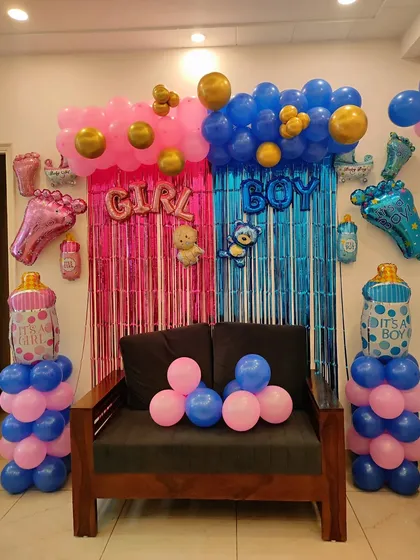 Building the suspense for your gender reveal is so much fun. I create these split backdrops with pink and blue tinsel, matching balloon pillars, and 'GIRL' or 'BOY' foil balloons to make the big reveal an unforgettable moment.