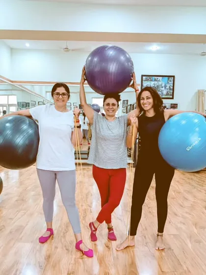 We love incorporating props like stability balls into our workouts. It adds a FUN challenge and helps with balance, coordination, and core engagement. There's never a dull moment in our group sessions.