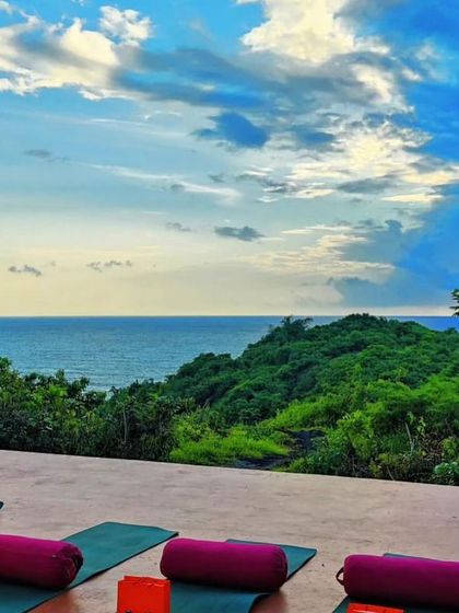 The stunning yoga deck at Cabo Serai, Goa, set up for our retreat. Practicing with this view is an unforgettable experience.