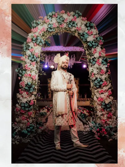 Here is a groom ready for his moment, wearing a custom-tailored ivory sherwani. I designed this piece with a matching stole and turban, creating a complete, cohesive look that feels both traditional and personal under the wedding arch.