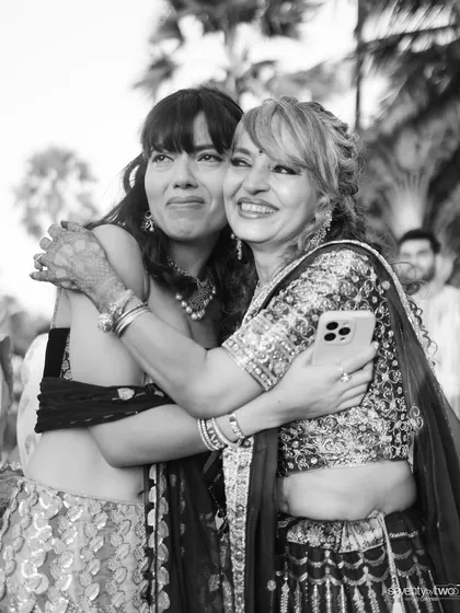 A heartfelt, emotional hug between two family members, captured in beautiful black and white. A testament to the deep bonds of family.