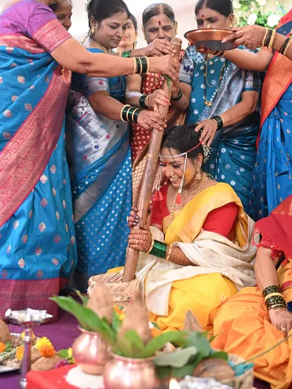 The 'Ghaana Bharne' ceremony is a fun and important ritual. The bride's makeup is designed to be durable and look great even in candid, action-filled moments.