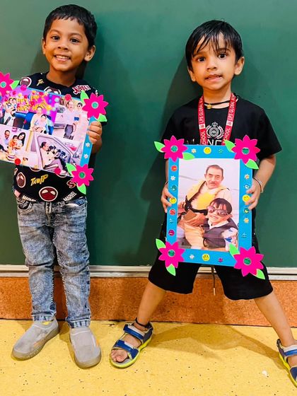 Two boys display their beautifully decorated photo frames, ready to be gifted on Grandparents Day. We believe in celebrating family and creating opportunities for children to show their appreciation.