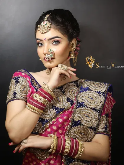 We specialize in teaching a variety of regional bridal styles, including this classic Maharashtrian bridal look. This professional photograph showcases the complete look, from the traditional nath and jewelry to the precise makeup and hair styling.
