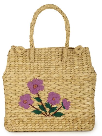 Our charming Kauna grass picnic basket, featuring delicate floral embroidery. This handwoven bag is not only a stylish accessory for outdoor escapes but also a durable and eco-friendly choice for everyday use.