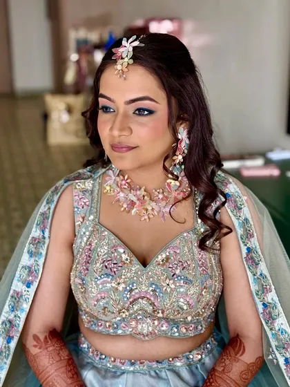 A close-up of the Haldi makeup, showing the beautiful pastel tones and the playful blue winged liner.