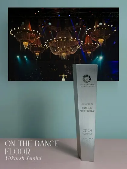 We won an award for this 'On the Dance Floor' shot. The image of the bride under magnificent chandeliers captures the grandeur and energy of a wedding celebration.