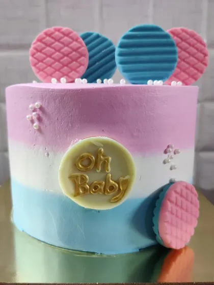 An "Oh Baby" cake, perfect for a baby shower or gender reveal party. The pink and blue colors keep everyone guessing.