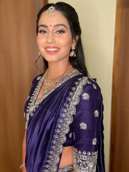 A portrait of the bride, looking effortlessly beautiful. The makeup is designed to enhance her features and give her a timeless glow.