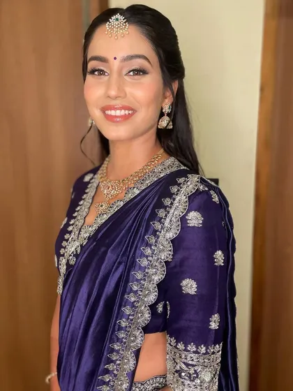 A portrait of the bride, looking effortlessly beautiful. The makeup is designed to enhance her features and give her a timeless glow.