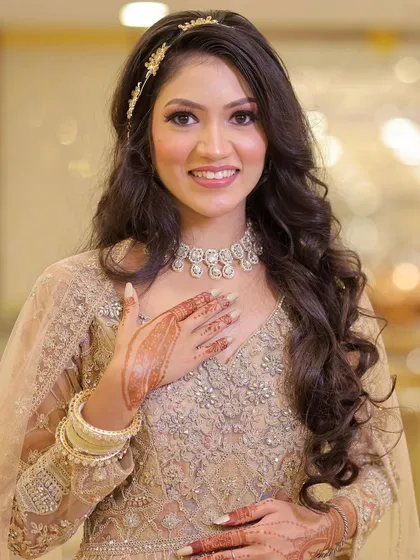 A radiant smile from this lovely engagement bride. Her makeup is soft and glowing, enhancing her natural beauty.