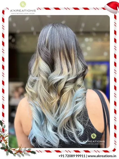 For those who dare to be different, we create bold, artistic color statements. This striking look features a platinum blonde fringe and icy blue ombre, showcasing our expertise in creative hair coloring.