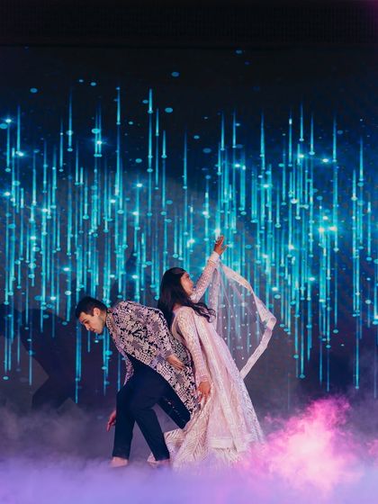 A dreamy pose from a romantic couple's dance. We love creating these picture-perfect moments that look straight out of a Bollywood fairytale.