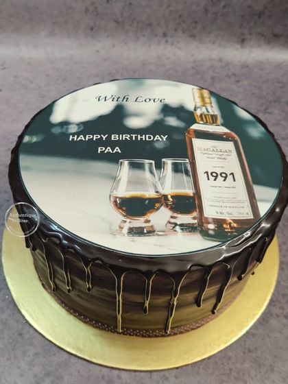 Our signature chocolate drip cake with a personalized edible photo of a favorite whiskey bottle.