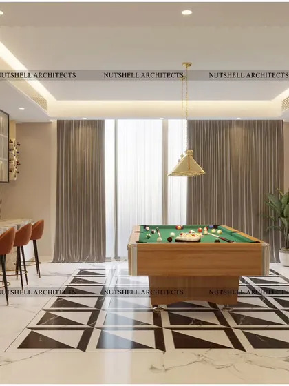 This ultimate billiards room is designed for stylish entertaining. It features a sleek marble-topped bar with comfortable seating, set against a backdrop of bold, geometric black and white marble flooring.