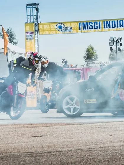 A closer look at the interaction between a drift car and stunt bikes, a unique performance that blends four-wheel and two-wheel artistry.