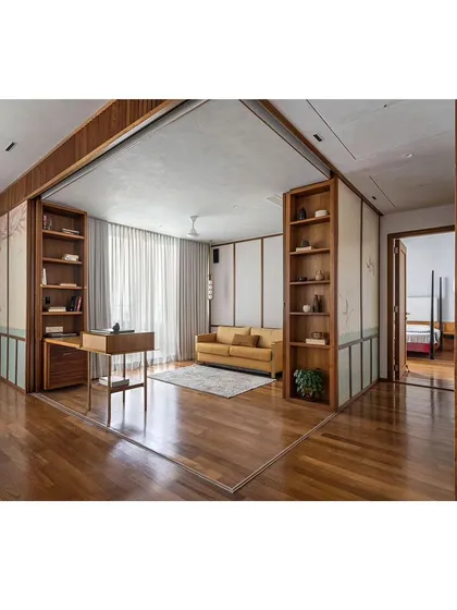 The Ikigai House features an open living area defined by rich hardwood floors and custom teak shelving, with sliding panels that can transform the space.