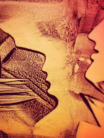 'Varne SuVarne'. This piece shows two faces in profile, seemingly in conversation or reflection. The different colors and textures suggest different personalities.