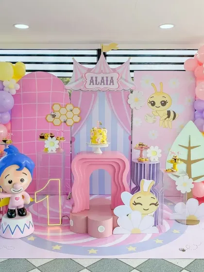 The full stage setup for the bee-themed party, showing the beautiful symmetry and the variety of props we use to create a complete world.