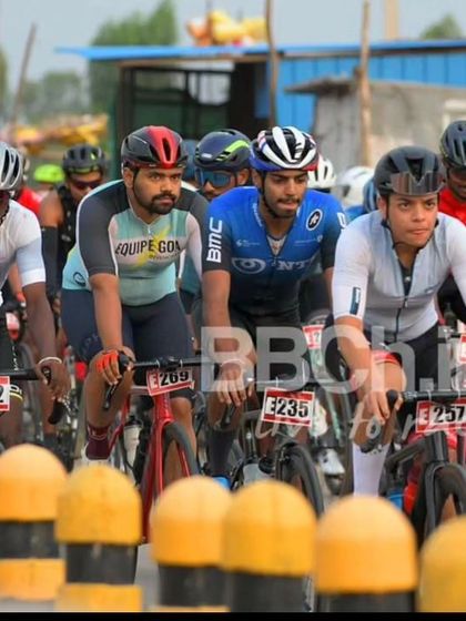 The elite peloton, with riders from various teams, is a colorful and dynamic sight.