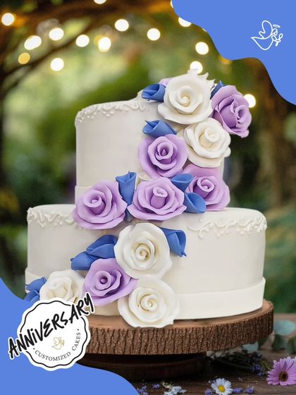 A beautiful two-tier anniversary cake decorated with a cascade of purple and white sugar roses. This enchanting design was created for a special couple's celebration in Hauz Khas.