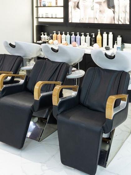 Our hair wash stations are designed for ultimate comfort and relaxation, featuring ergonomic chairs and a full range of premium products ready for your treatment.