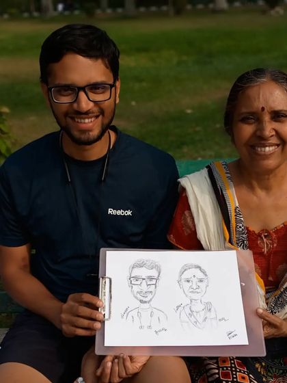 Another shot of Harsha sir and his mom, their smiles showing their happiness with the sketch.