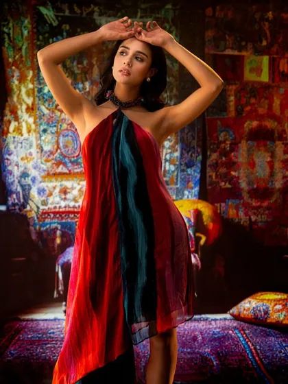 A vibrant, bohemian-style room filled with colorful textiles, created with projection. This technique allows me to build a rich, textured, and culturally specific environment in the studio.