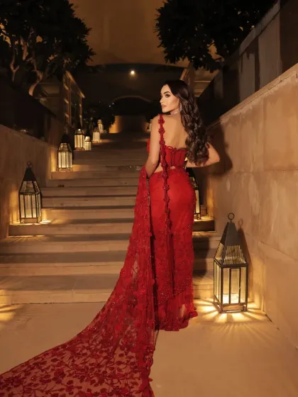 A back view of the dramatic red gown. The long, embroidered train is a key feature I wanted to highlight, perfect for making a grand entrance.