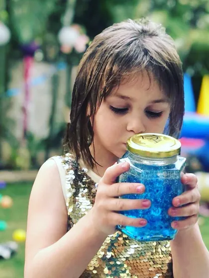 For our custom-themed birthday parties, every detail is thoughtfully planned. At this mermaid-themed celebration, each child created their own magical ocean in a jar, a beautiful sensory craft they could take home as a party favor.