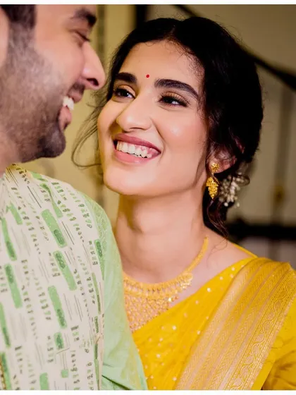 A happy, candid moment between Aditi and her husband. Her fresh, dewy skin work looks incredible up close.