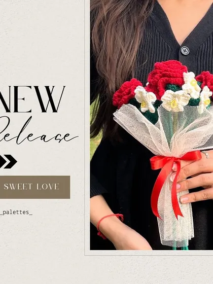 Our new 'Sweet Love' bouquet is here! This romantic arrangement features classic red roses mixed with small white flowers, held by a model.