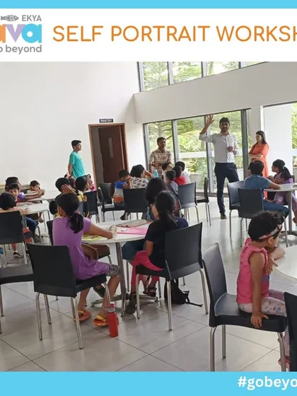 A wide shot of the Self-Portrait Workshop in progress, with families gathered at tables, fully engaged in their art. This image captures the collaborative and lively atmosphere of my weekend events.