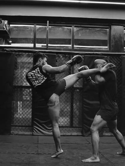Precision and power. A perfectly executed head kick during a hard sparring session. We drill striking relentlessly, focusing on timing and technique, not just brute force. This is the art of combat, honed daily on our mats.