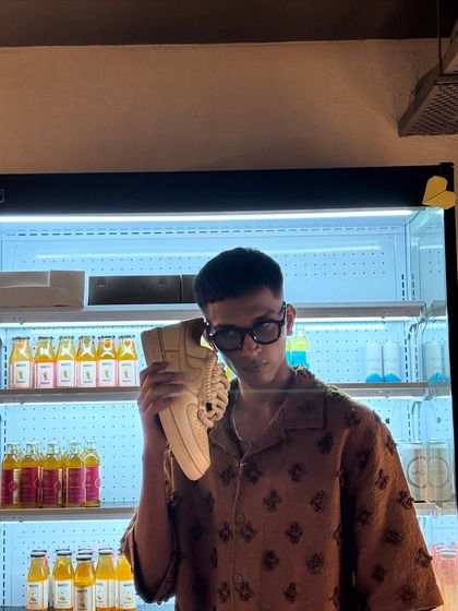 The creator himself posing with the coffee custom sneakers.